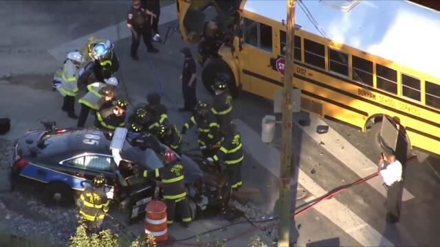 City police officer injured after vehicle crashes into school bus