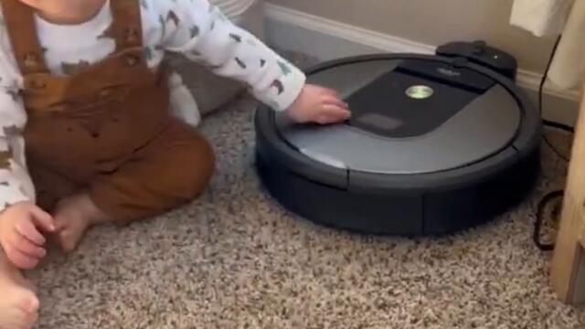 Baby Takes on Roomba in Not-so-Epic Battle #Shorts