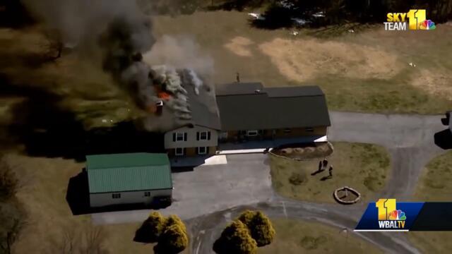 Fire burns through roof of Mount Airy-area home