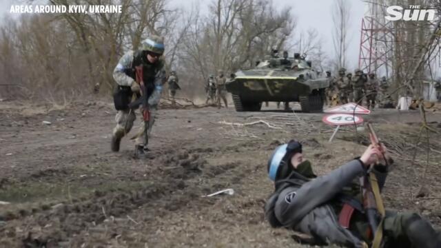 Ukrainian soldiers survey areas liberated from Russian forces outside Kyiv