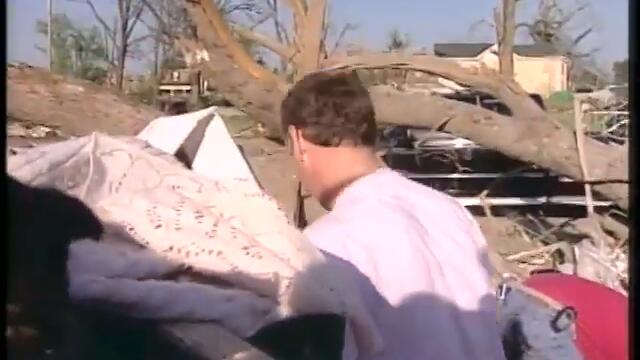 2002: La Plata residents comb through debris after tornado
