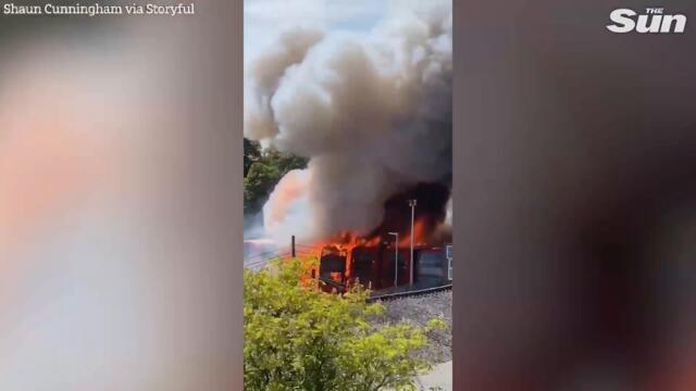 Bus EXPLODES in massive blaze at Hertfordshire garage