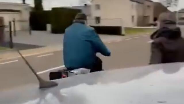 Man spits on car, but gets nasty surprise.