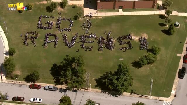 Baltimore students form 'Go Ravens!' on Purple Friday