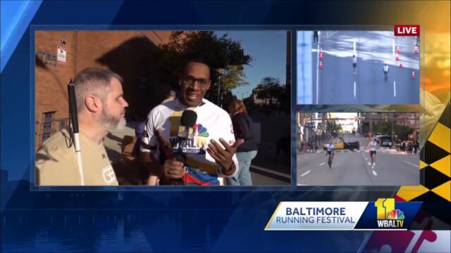 National Federation of the Blind mans Baltimore Running Festival water stop