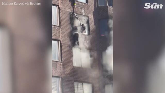 NYC firefighters rescue woman dangling from window during apartment blaze