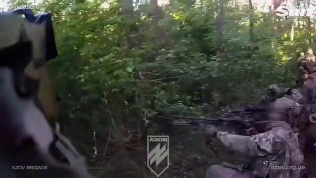 Bullets fly as Ukraine's Azov fighters ambush Russians in epic first-person footage