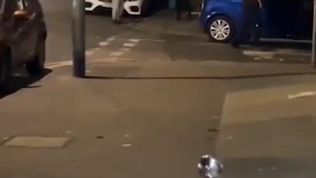 Terrifying moment machete duel erupts in street as rival gangs swing wildly at each other