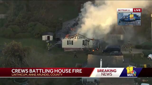Breaking: House fire burns through roof in Linthicum