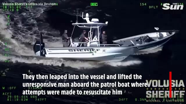 Watch moment cop leaps into out-of-control boat to save unconscious man