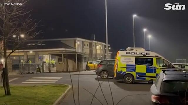 Child dies after being hit by BMW on rugby club pitch as driver held